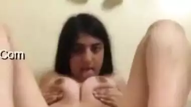 Naked Desi chick poses nude and XXX licks her perky boobs for show