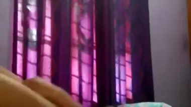 Tempting Indian woman sets camera to film XXX breasts during sex posing