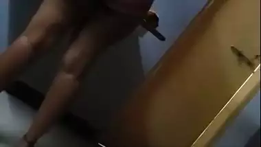 Hot figure standing topless in front of mirror