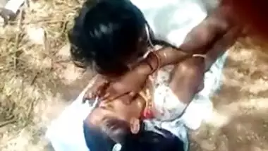 Guy lies on top of Desi girlfriend in front of XXX cameraman outdoors