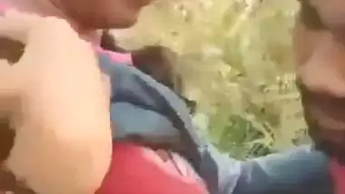 Indian outdoor sex of a guy sucking his GF’s tight boobs