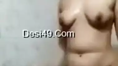 Cheerful Desi girl comes to the bathroom where she films XXX video